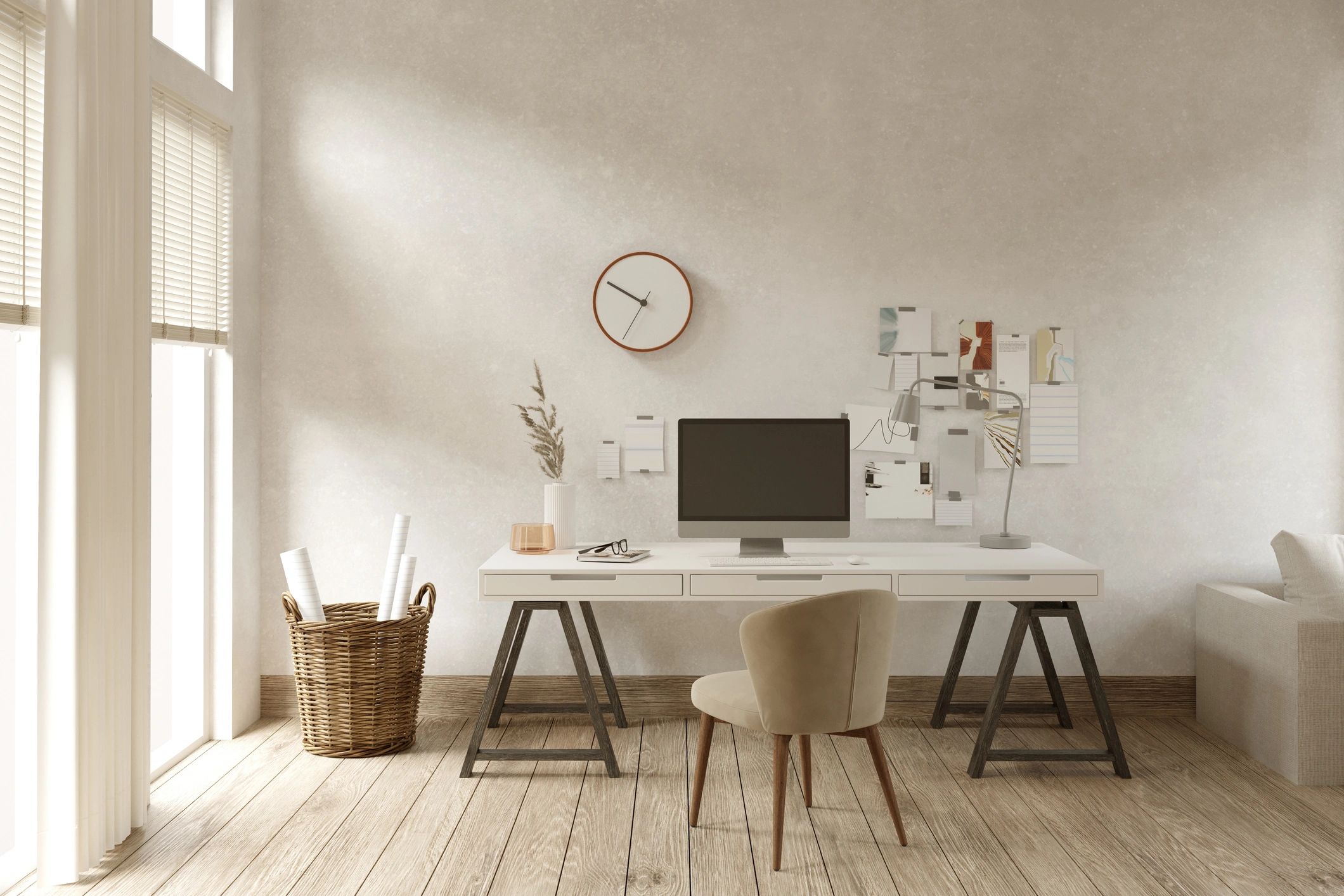 Workspace with plans and a laptop for renovation feasibility research