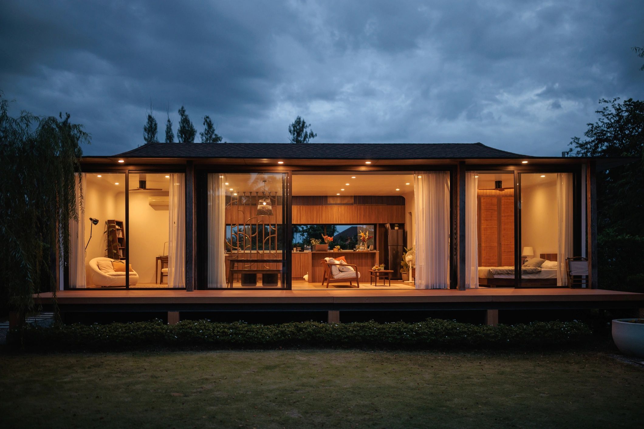 Modern small backyard dwelling exterior at dusk