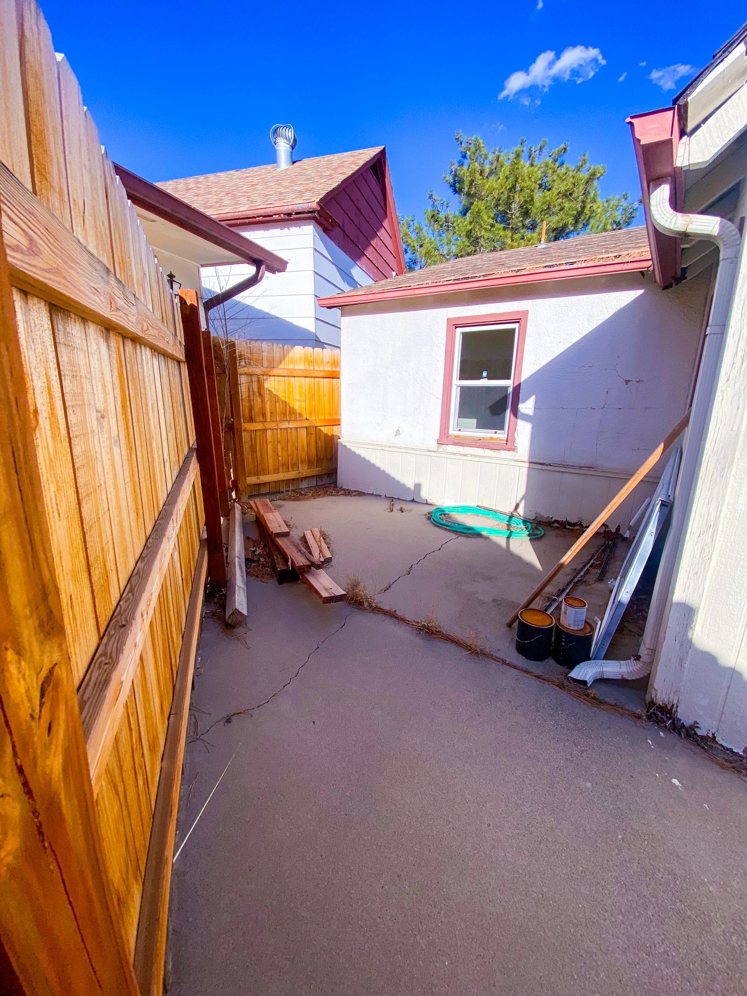 Small backyard courtyard and outbuilding exterior